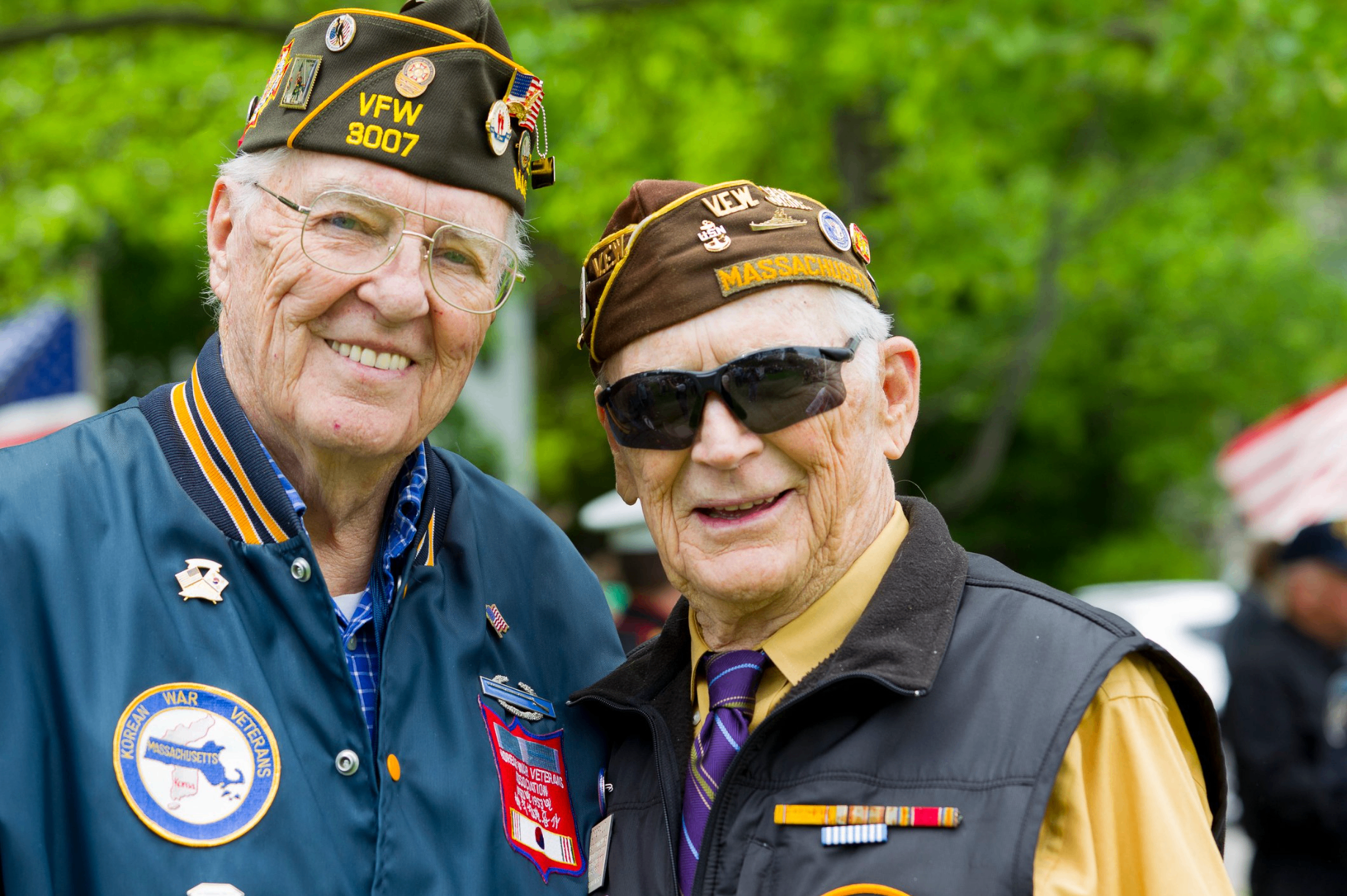 Two proud veterans in VFW caps representing veteran community and services
